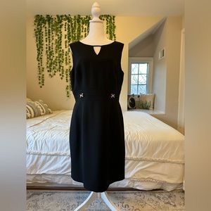 Black sheath dress with gold detail